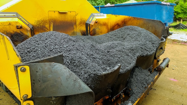 Asphalting paver machine during Road street repairing works