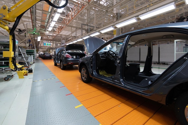 Assembled car is on the Assembly line Robotic equipment makes the Assembly of the car Modern car Assembly at the factory