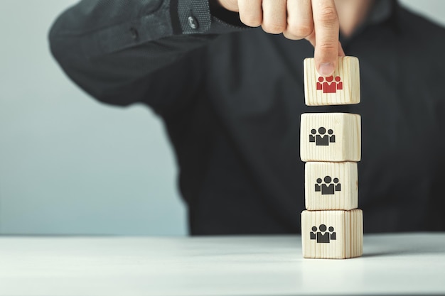 Assembled wooden cubes on the theme of business leadership