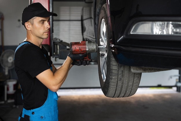 Assembly or dismantling of the wheels in the workshop repair and maintenance of the car in service