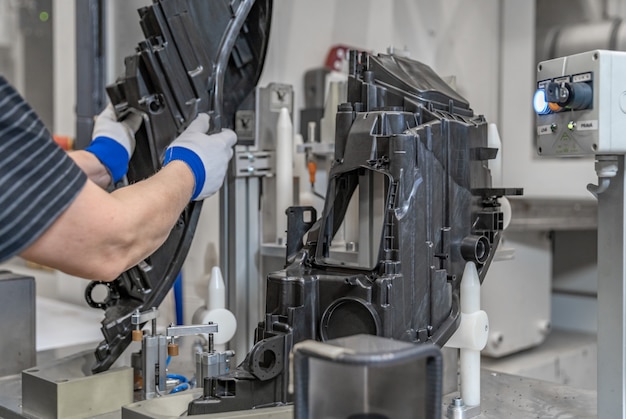 Assembly of plastic molds on the production line in the factory