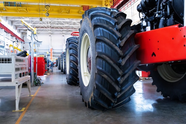 Assembly workshop at big industrial plant tractor assembling