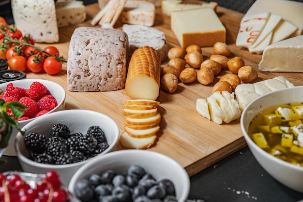 Assorted cheese slices on a board