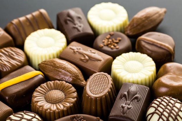 Assorted chocolates on a black background.