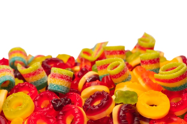 Assorted colorful gummy candies Top view Jelly donuts Jelly bears Isolated on a white background