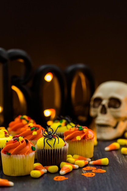 Assorted cupcakes with yellow and orange icing decorated for Autumn.