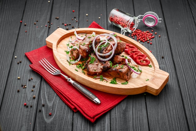 Assorted delicious grilled meat with vegetable on white plate picnic table for family bbq party