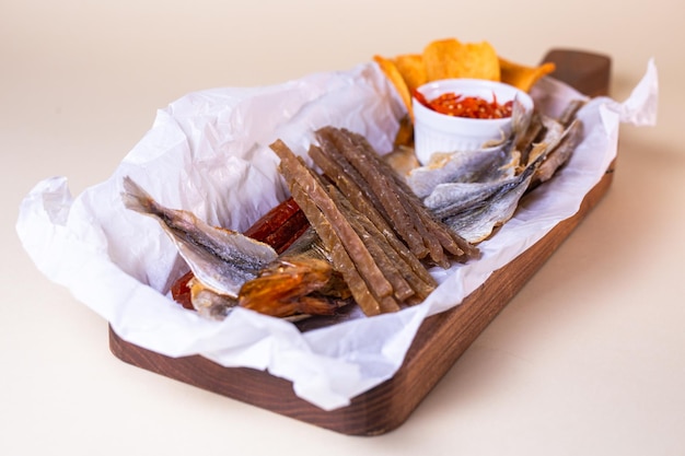 assorted dry fish for beer fish on a wooden board