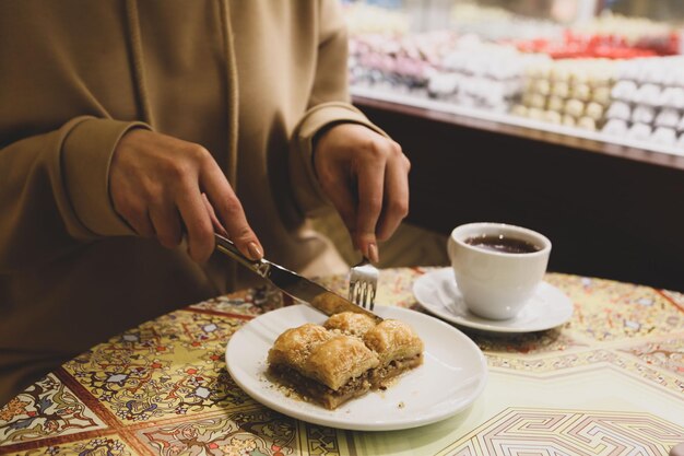 Photo assorted flavors of turkish baklava with pistachio and other turkish sweets