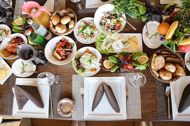 Photo assorted food spread on table