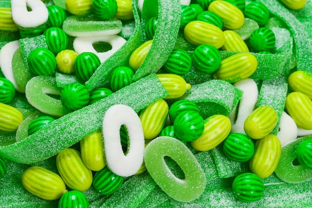 Assorted green gummy candies background. Top view. Jelly  sweets.