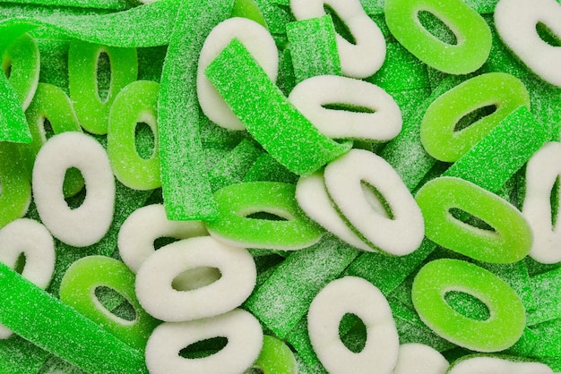 Assorted green gummy candies background Top view Jelly sweets