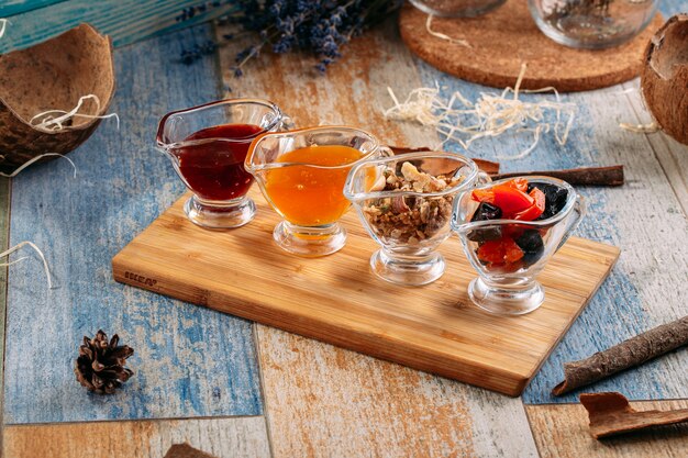 Assorted jam tea set and nuts in glass jars