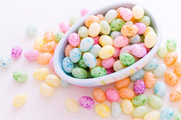 Assorted jelly beans in pastel colors with darker spots.