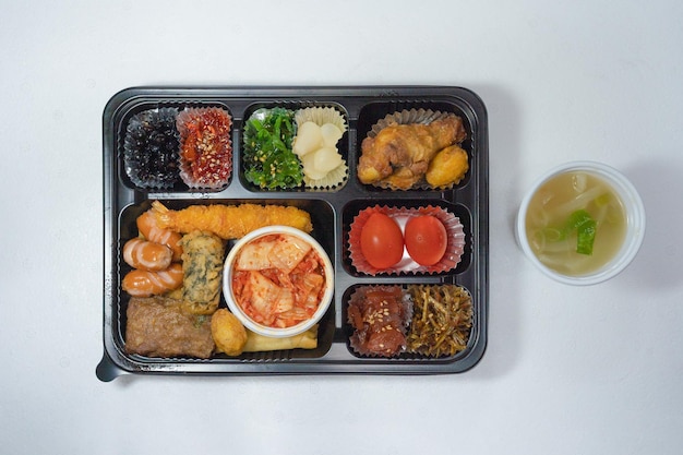 Assorted lunch box with various Korean side dishes