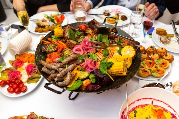 Assorted meat and vegetables fried in a wok