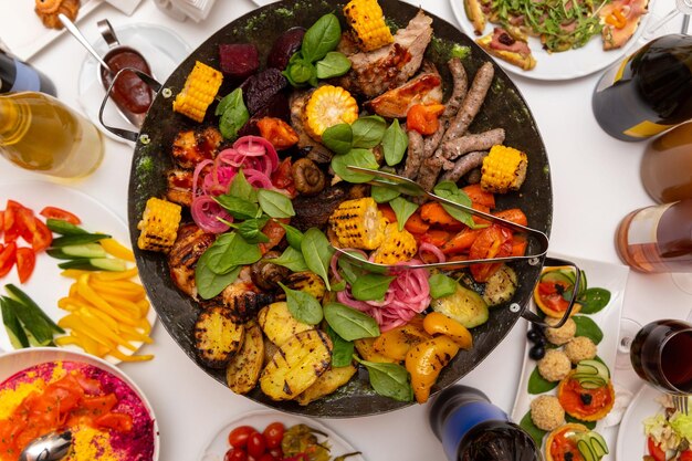 Assorted meat and vegetables fried in a wok