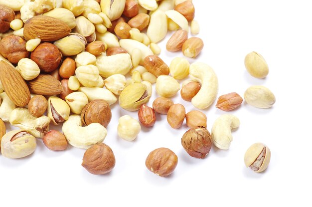 Assorted mixed nuts on white background