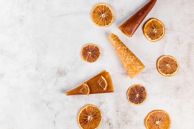 Assorted pastille rolls Fruit leather pastille cones and dried oranges