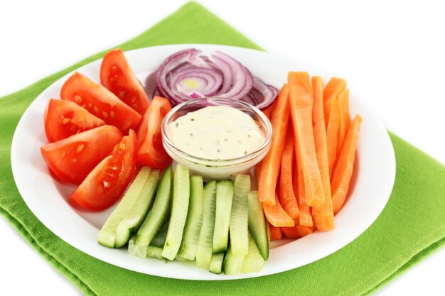 Assorted raw vegetables sticks in plate close up