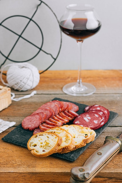 Assorted smoked sausages, appetizer to red wine on wood