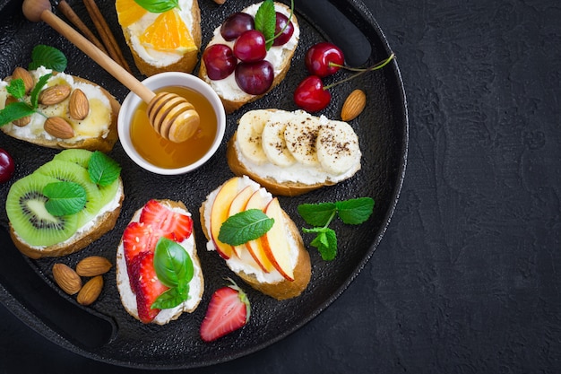 Assorted summer sweet snacks. Bruschetta or sandwiches