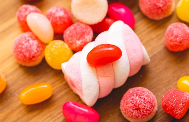 Assorted sweets on a wooden board in macro photography