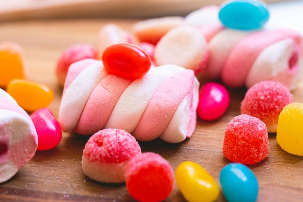 Assorted sweets on a wooden board in macro photography