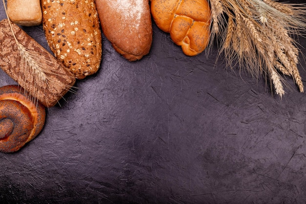 Assortment of baked bread loaves of rye and wheat breadfood concept