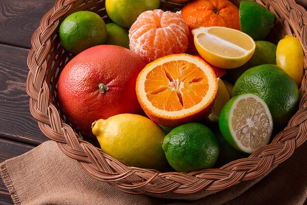 Assortment citrus fruits in a basket closeup top view no people