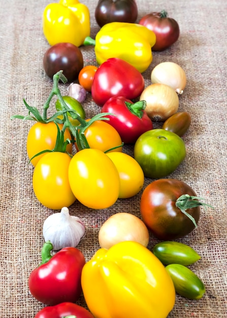 Assortment of colorful fresh vegetables on sackcloth surface