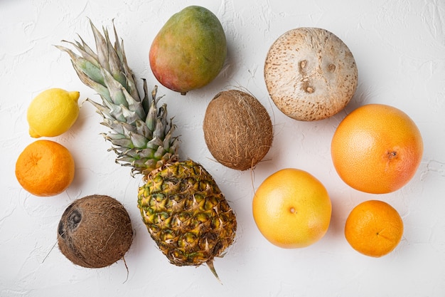 Assortment of different fruits set, on white stone table background, top view flat lay