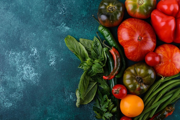 Assortment of different tomatoes pepper and basil