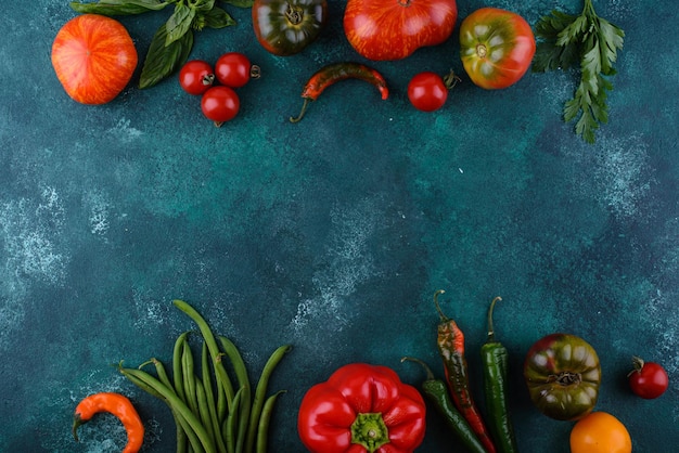 Assortment of different tomatoes pepper and basil