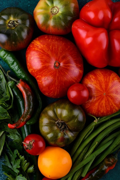 Assortment of different tomatoes pepper and basil