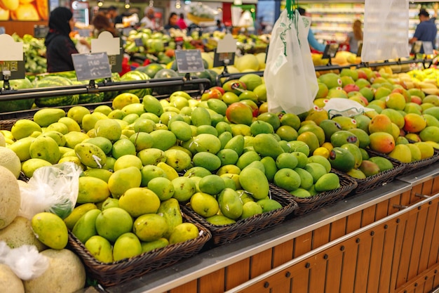 Assortment of fresh fruits on counter in supermarket