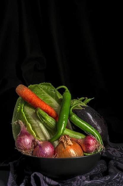 Assortment of fresh vegetables with dark background