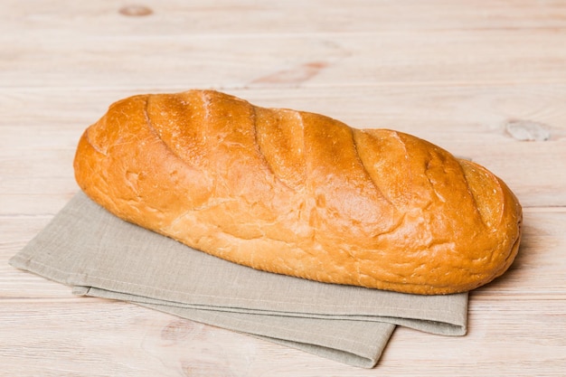 Assortment of freshly baked bread with napkin on rustic table top view Healthy unleavened bread French bread