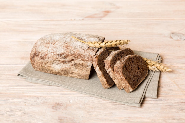 Assortment of freshly sliced baked bread with napkin on rustic table top view Healthy unleavened bread French bread slice