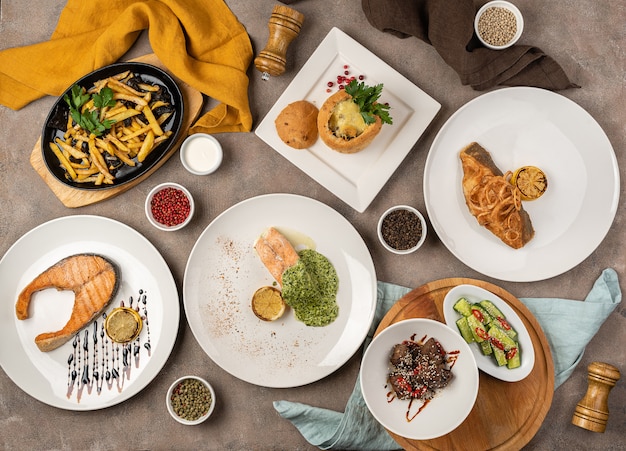 Assortment of meat and fish dishes on the table