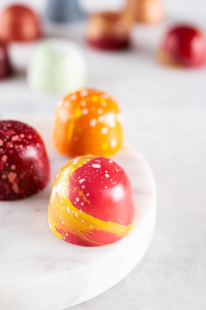 Assortment of painted chocolate pralines Handcrafted bonbonsDelicious dessert