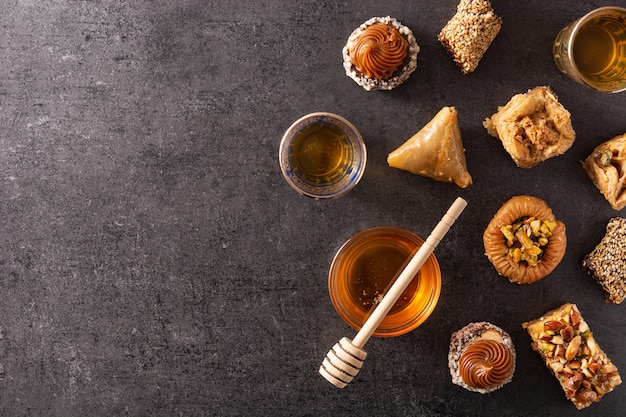 Assortment of Ramadan dessert baklava on black background