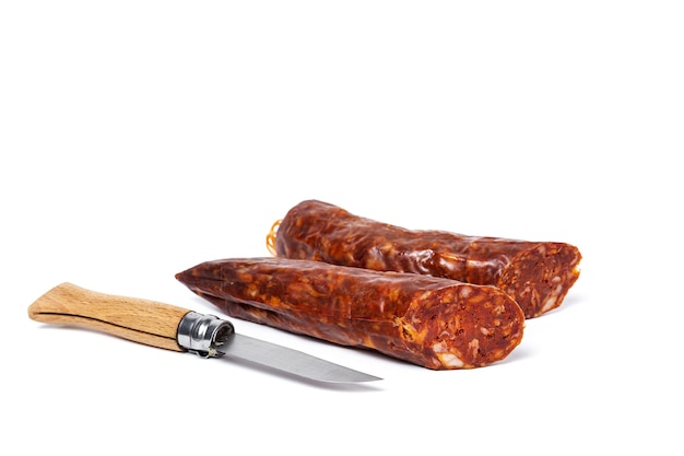 Assortment of typical Spanish homemade sausages with a colorful background. Iberian Chorizo and Salchichon