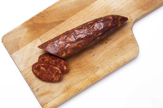 Assortment of typical Spanish homemade sausages with a colorful background. Iberian Chorizo and Salchichon