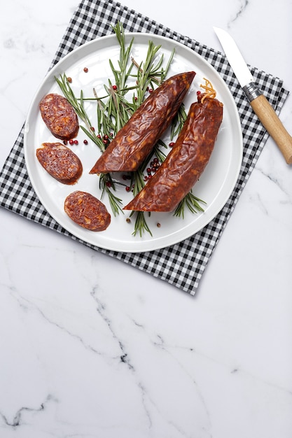 Assortment of typical Spanish homemade sausages with a colorful background. Iberian Chorizo and Salchichon