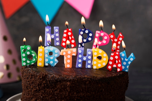 Assortment with birthday candles and cake