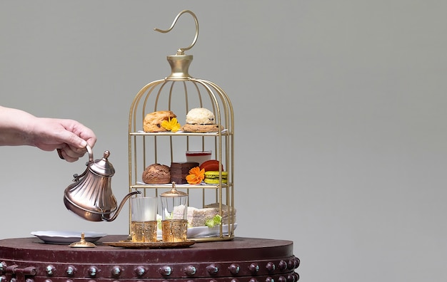 Assortments of desserts and snacks on a beautiful Moroccan style afternoon tea set