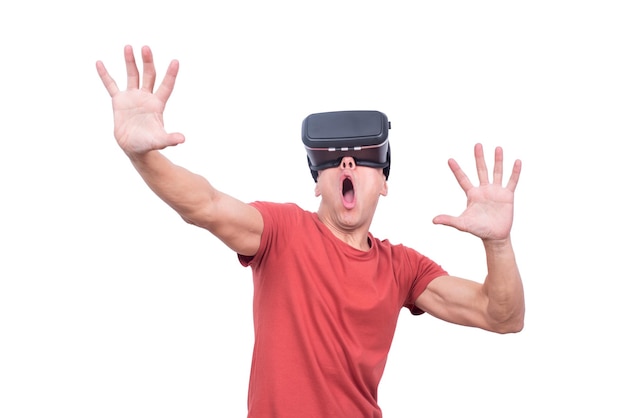 Astonished man exploring virtual reality in goggles