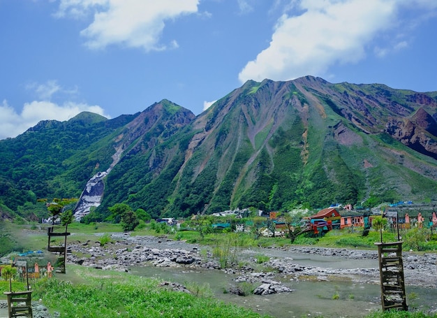 Astonishing mountains landscape with clouds and greenry