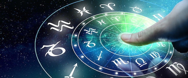 Astrological zodiac signs inside of horoscope circle Man or Woman touching screen Zodiac signs